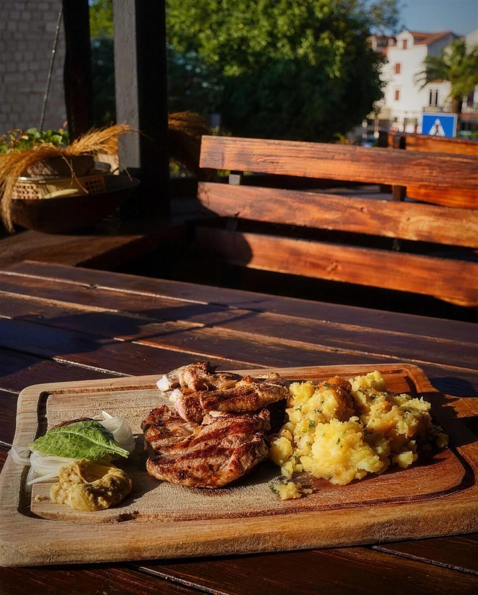 Grilled meat on the terrace in evening light